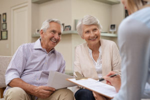 Senior couple meeting financial advisor to help get out of debt