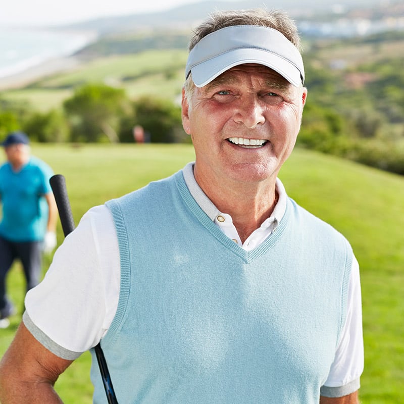 Retired man enjoying golf
