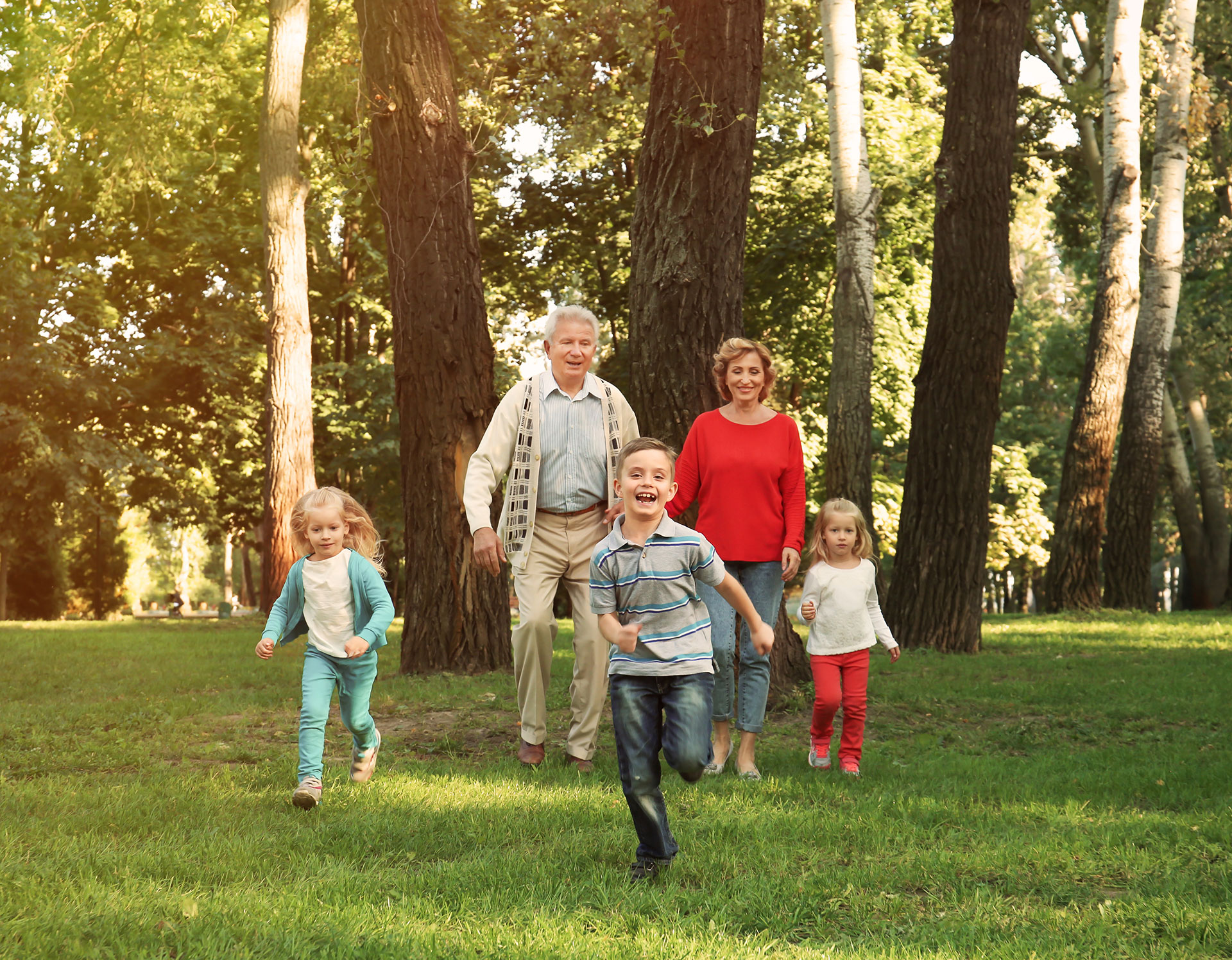 retirement-legacy-family Grandparents playing outside with three grandkids the legacy of good tax management for their retirement