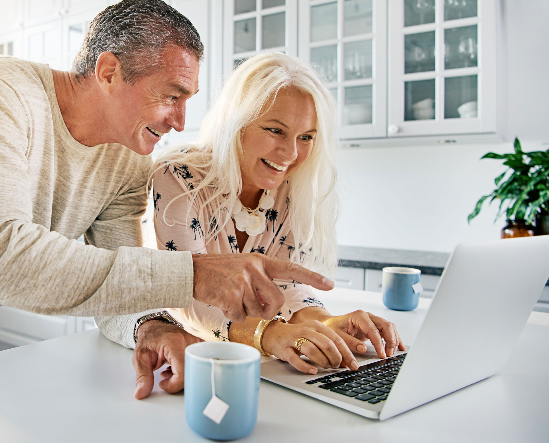 tax-planning-couple Couple learning about tax planning options while looking at a laptop